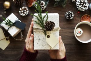 handmade craft with pinecone and paper gift tage attached
