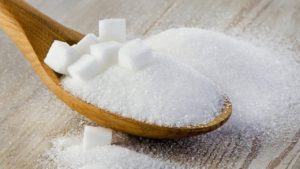 sugar in a wooden spoon