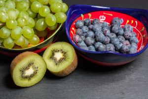 bowl filled with green grapes and blueberries